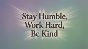 勵志語錄文字，內容為 stay humble work hard be kind，背後有發光光線。