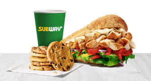 Subway 雞肉三明治搭配餅乾和飲料，放在紋理表面上。 — 地鐵 壁紙
