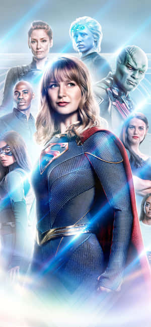 Supergirl 和她的超級英雄團隊在發光的動作場景中。 — iPhone 17 Pro 壁紙