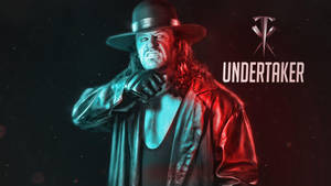 摔角手 Undertaker 戴黑色帽子穿風衣，在紅藍燈光下。 — 送葬者 壁紙
