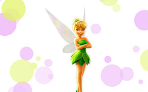 Tinker Bell 身穿綠色葉子裙，帶翅膀，被粉彩泡泡包圍。 — 小叮噹 壁紙