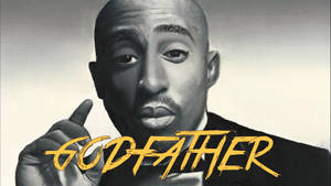Tupac Shakur 向上指，帶有黃色 'GODFATHER' 文字。