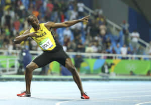 Usain Bolt 身穿牙買加球衣在跑道上慶祝贏得比賽。 — 運動 壁紙