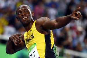 Usain Bolt 身穿黃色牙買加球衣慶祝贏得奧運短跑比賽。 — 運動 壁紙