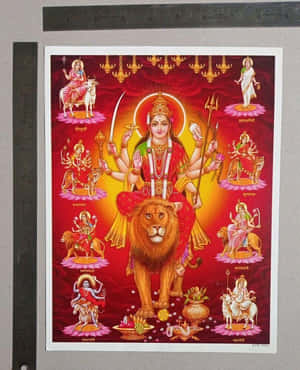 印度教女神杜爾迦有十臂騎著獅子，被她的九種形態圍繞。 — Maa Durga 壁紙