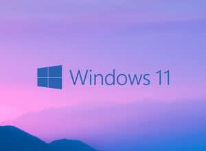 Windows 11 標誌以紫色粉紅色山脈日落為背景 — 丘陵景觀 壁紙