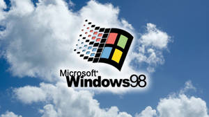 Windows 98 標誌在藍天白雲下。 — Windows 98 壁紙