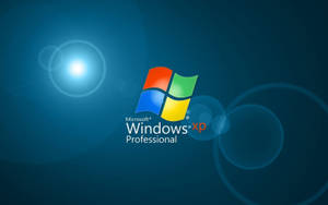 Windows XP Professional 標誌在藍色漸變背景上帶有鏡頭光暈
