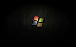Windows 標誌在深色皮革背景上柔和發光 — 暗黑美學電腦 壁紙