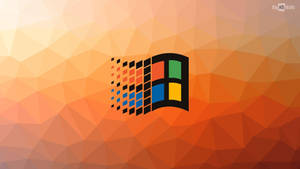 Windows 標誌在漸變多邊形背景上呈現像素化運動。 — Windows 98 壁紙