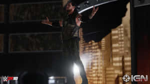 WWE 2K18中，摔角手在燈光舞台上表演，身後是城市燈光。 — 電玩遊戲 GIF 壁紙