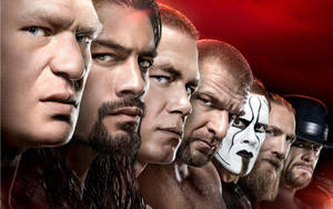 一排 WWE 摔角手，表情兇猛，燈光戲劇化。 — 摔角 壁紙
