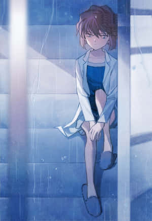 一個悲傷的動漫女孩穿著藍色外套坐在下雨的窗台上。 — iPhone Duo 壁紙