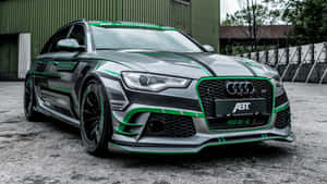 定製灰色Audi RS6-E，帶有綠色點綴，停在倉庫前。 — 奧迪R8 壁紙