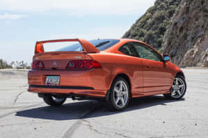 橙色Acura RSX跑車停放在路邊，靠近岩石懸崖 — Acura 壁紙