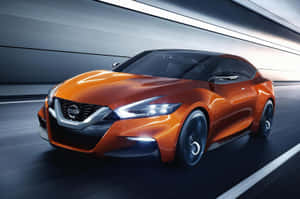 橙色日產概念車在夜間黑暗的高速公路上疾馳。 — 日產 壁紙
