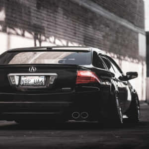 黑色Acura轎車紅色尾燈停泊在磚牆旁 — Acura 壁紙