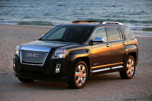 日落時黑色GMC Acadia SUV停泊在沙灘上 — 日產 Skyline GTR R34 壁紙