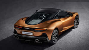 銅色McLaren跑車，黑色車頂和車輪，在深色混凝土上。 — 白色法拉利 壁紙