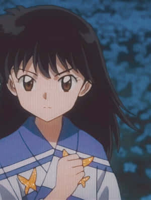 夜晚穿著校服的動漫女孩手持金色星星。 — Kindle 壁紙