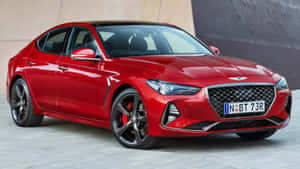 紅色Genesis G70轎車停放在混凝土牆旁 — 創世紀 壁紙