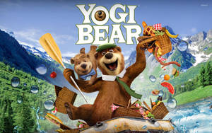 Yogi Bear 和 Boo Boo 在山間河流上的一艘裝滿食物的木筏上。 — 瑜伽熊 壁紙