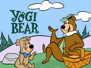 Yogi Bear 和 Boo Boo 在卡通森林中野餐。 — 瑜伽熊 壁紙