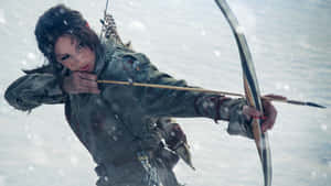 一位女戰士在暴風雪中瞄準弓箭。 — 古墓奇兵 壁紙