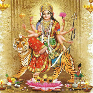 印度教女神騎著老虎，周圍有供品和蠟燭。 — Maa Durga 壁紙