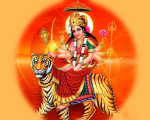 多臂印度教女神騎著老虎，手持武器和蓮花。 — Maa Durga 壁紙