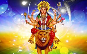 多臂印度教女神在光芒四射的宇宙場景中騎著獅子。 — Maa Durga 壁紙