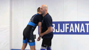 BJJ教練在訓練期間指導運動員 — 摔角 壁紙