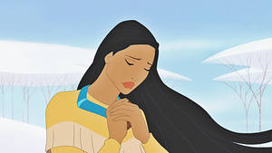 一位女子在雪景中，閉著眼睛，雙手合十祈禱。 — Pocahontas 壁紙