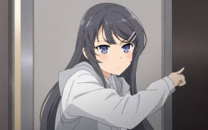 深色長髮和藍色眼睛的動漫女孩在走廊上向前指。 — 櫻島麻衣 壁紙