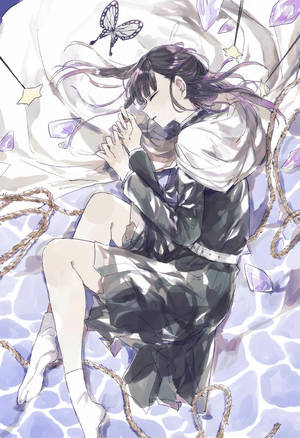 動畫女孩在漂浮的水晶和繩索環繞中擁抱自己。 — 鬼滅之刃 壁紙