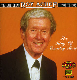 Roy Acuff 微笑的肖像，身穿黑色西裝，背景為橙色。 — 德里克·亨利 壁紙