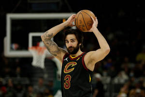 黑色球衣號碼3的籃球運動員準備投籃。 — 克里夫蘭騎士隊 壁紙