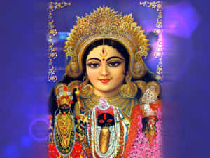 印度教女神身穿華麗金飾和紅色服飾，散發神聖光輝。 — Maa Durga 壁紙