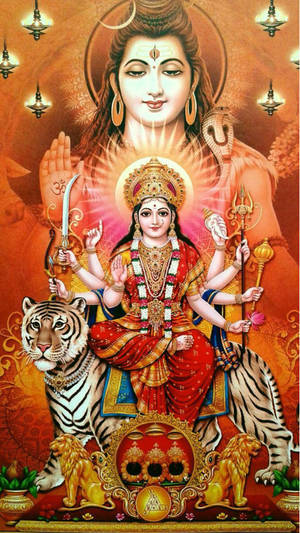 印度教女神騎虎，多臂並帶有神聖符號。 — Maa Durga 壁紙