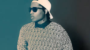 一位在攝影棚環境中戴著太陽眼鏡和圖案毛衣的人士。 — ASAP Rocky 壁紙