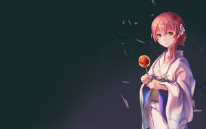 粉紅色頭髮的動漫女孩穿著和服，拿著發光棒棒糖，花瓣飄落。 — 日本動漫 壁紙