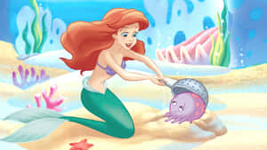 美人魚在水下與珊瑚和海星一起玩章魚。 — 愛麗兒 GIF 壁紙
