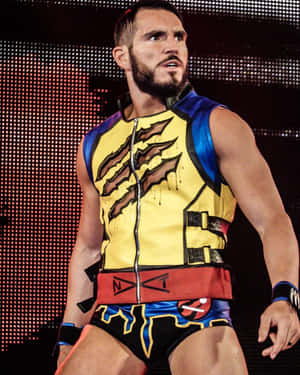 身穿色彩繽紛服裝的摔角手在明亮的舞台燈光下擺姿勢。 — WWE GIF 壁紙