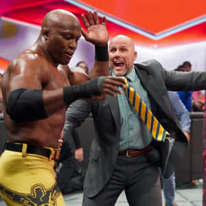 摔角手與教練在比賽中激烈對峙。 — WWE GIF 壁紙