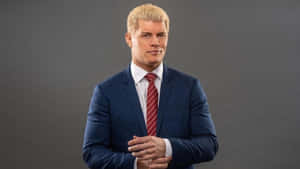 藍色西裝紅色領帶的男人在攝影棚擺姿勢拍照 — WWE GIF 壁紙