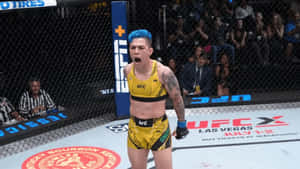 女性MMA拳手在UFC八角籠中以藍色頭髮和黃色裝備慶祝勝利。 — 終極格鬥冠軍賽 壁紙