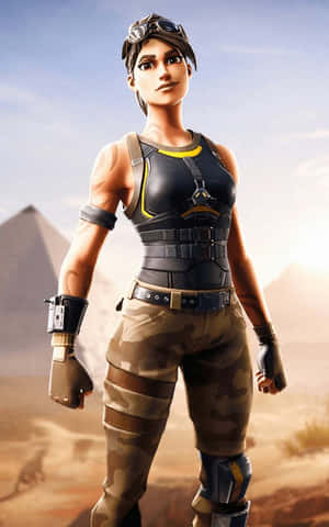身穿沙漠裝備的女性Fortnite角色在日落時分站在金字塔前。 — Nubia Flip2 壁紙