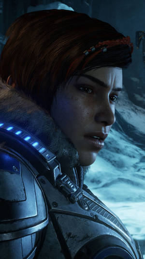 身穿裝甲服的女兵在雪地山區環境中向前看。 — 電玩遊戲 GIF 壁紙