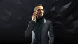 穿西裝男子在深色幾何背景下打電話 — 《Deus Ex：人類分裂》 壁紙