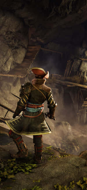 身穿盔甲的武士站在迷霧洞穴的懸崖邊緣 — 電玩遊戲 GIF 壁紙